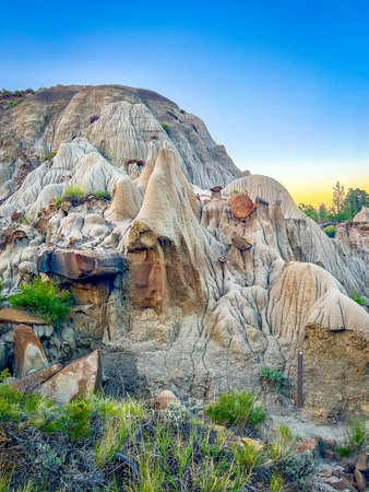 Beautiful formations of rocks and sandstone at dusk on the Kinney Coulee trailの写真素材