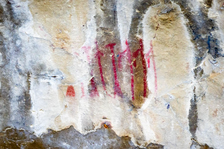The ancient rock paintings and symbols, known as pictographs, at Pictograph Cave State Park tell stories of prehistoric life in Montanaの写真素材