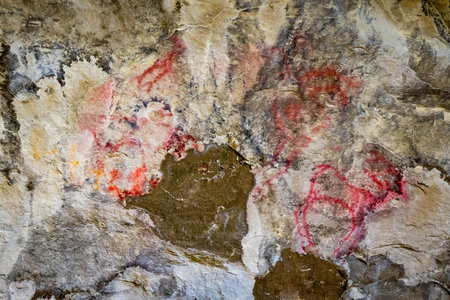 The ancient rock paintings and symbols, known as pictographs, at Pictograph Cave State Park tell stories of prehistoric life in Montanaの写真素材