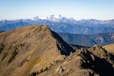 A vibrant view captures the dramatic landscape and high-alpine scenery of Obstruction Point, bathed...