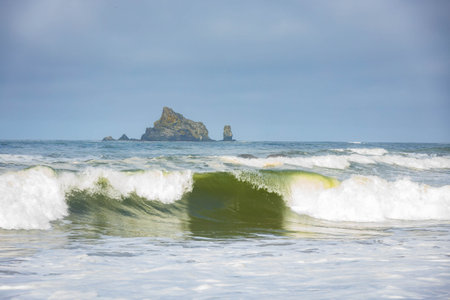 Famous Hole-in-the-Wall rock formation, an iconic arch sculpted by waves on the Pacific Ocean shore...