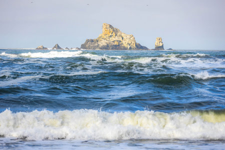 Famous Hole-in-the-Wall rock formation, an iconic arch sculpted by waves on the Pacific Ocean shore...