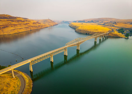 A breathtaking aerial view of the Lyons Ferry Bridge spanning the tranquil waters at Lyons Ferry...