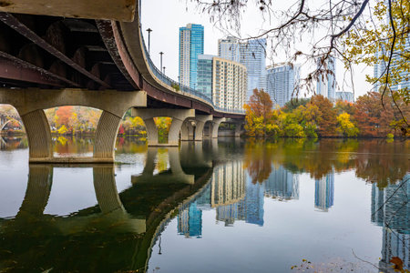 Overview of Austin skyline skyscrapers and business centers viewed from Pfluger Pedestrian Bridge above the Colorado River