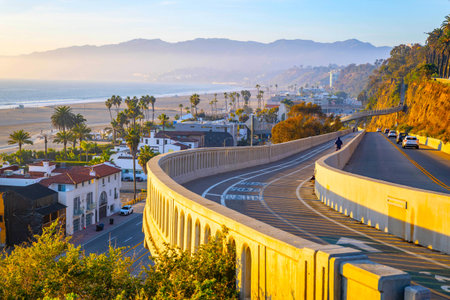 Sunset light washes over the Santa Monica coastline and Pacific Coast Highway as seen from downtown...