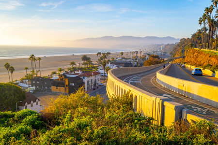 Sunset light washes over the Santa Monica coastline and Pacific Coast Highway as seen from downtown...