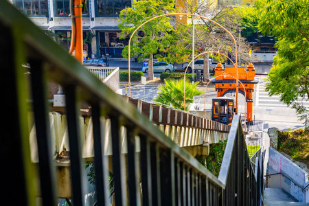 Los Angeles, CA, USA - December 03, 2025: Angels Flight Historic orange and black funicular cars...