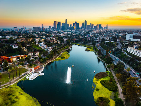 Los Angeles, CA, USA - December 03, 2025: Aerial panorama shows Los Angeles skyscrapers at sunset seen from Echo Park Lake in Californiaのeditorial素材