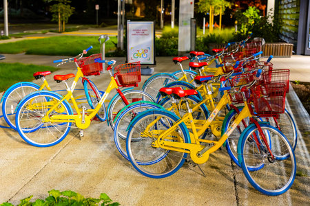 Mountain View, CA, USA - November 19, 2025: Colorful branded bicycles parked in employee bike lot at Google campus in Mountain View Californiaのeditorial素材