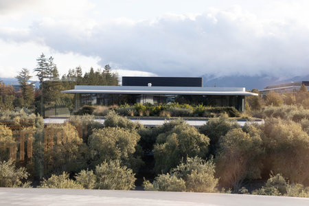 Cupertino, CA, USA - November 20, 2025: Modern Apple corporate office building stands in Santa Clara...