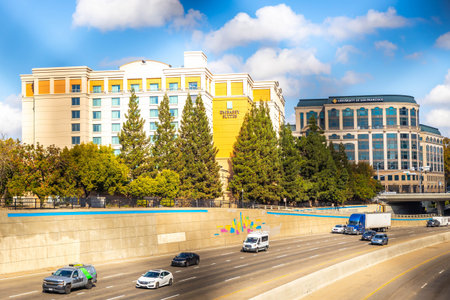 Sacramento, CA, USA - November 12, 2025: Wide urban panorama of Sacramento skyline seen from across...