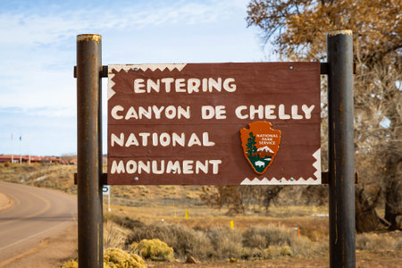 Muerto, AZ, USA - January 28, 2025: Road sign marking entry into Canyon de Chelly National Monument along access route in desert landscapeのeditorial素材