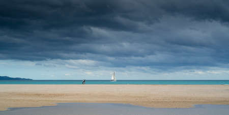 poetto beach with a sailboat. Freedom concept