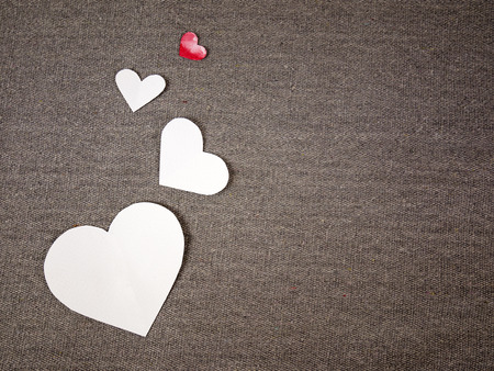 paper hearts on grey fabricの写真素材