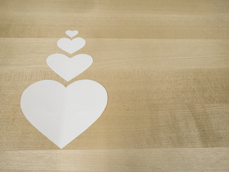 paper hearts on woodの写真素材