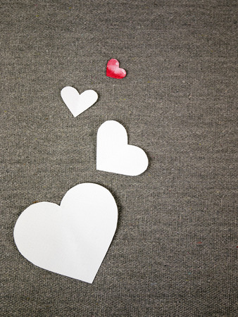 paper hearts on grey fabricの写真素材