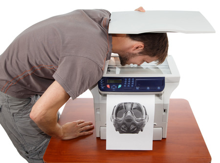 Man scanning his face in copierの写真素材