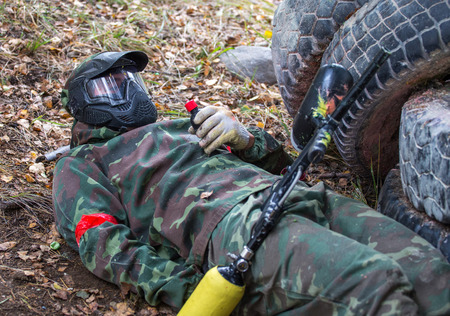 Lying soldier is going to blow up grenade on trainingの写真素材