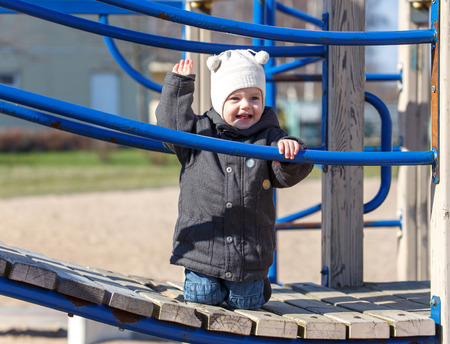 Kid raises his hand up for a walk