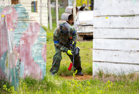 Soldier with paintball gun on tactical military trainingの写真素材