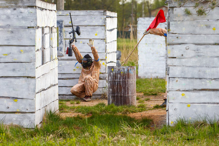 Extreme capture of red flag in paintball gameの写真素材