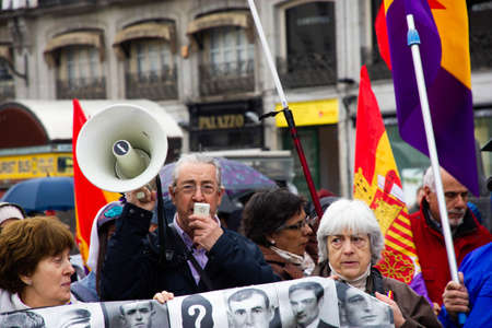 Senior man with megaphone in a protestのeditorial素材