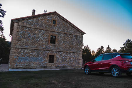 A red car in a rural space of vacationsのeditorial素材