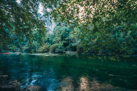 Ecological place with clean air and clear transparent mountain river from a large mountain sourceの写真素材
