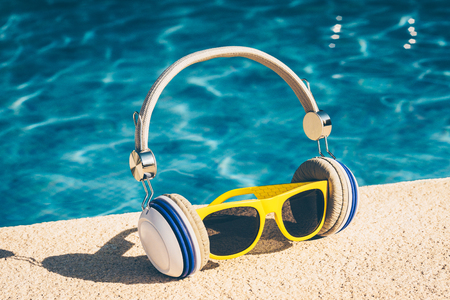 Hipster Set - Bright Plastic Sunglasses and Headphonesの写真素材