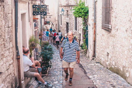 Saint-Paul-de-Vence, Provence / France - September 28, 2018: Many tourists on the narrow old streetのeditorial素材