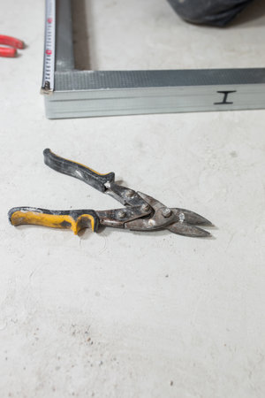 The master forms a metal profile from tin - construction of a frame wallの写真素材