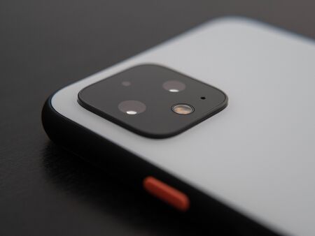 UK, October 2019: Pixel 4 white smart phone close up camera lens and power buttonのeditorial素材