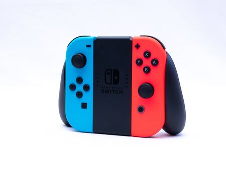 UK, Jan 2020: Nintendo switch games console joy con grip controller on white background