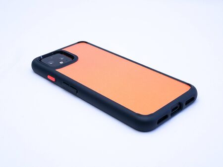 UK, Jan 2020 Google Pixel 4 Orange mobile phone on protective case on white background