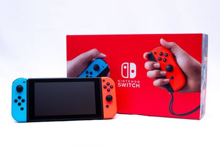UK, Jan 2020: Nintendo switch console with controllers on boxのeditorial素材