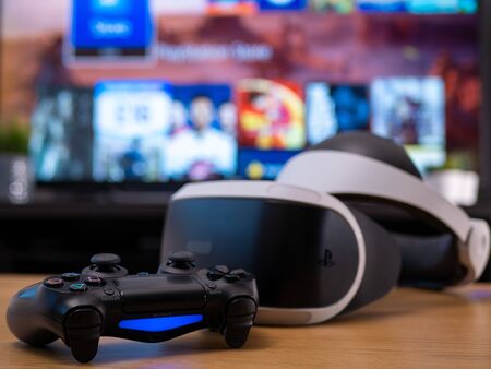 UK, Jan 2020: Virtual reality VR Sony headset for Playstation with Dualshock remote controller in...