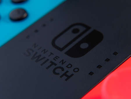 UK, March 2020: Nintendo Switch Joy Con Grip close up logoのeditorial素材