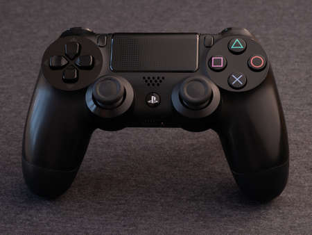 UK, March 2020: Black Sony PS4 playstation pad controller from above