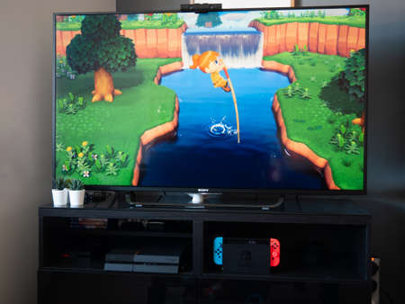 May 2020, UK: Nintendo switch animal crossing new horizons character on tv monitor