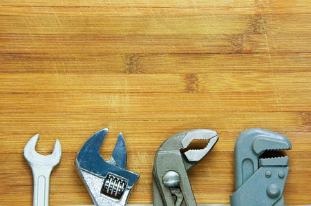 wrench, adjustable wrench, sanitary key on wooden backgroundの写真素材