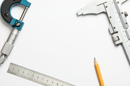 measuring instruments, pencil and white sheet of paperの写真素材