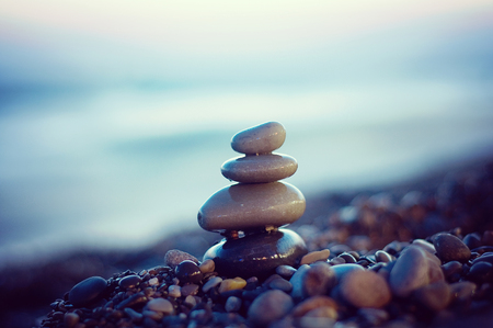 Zen stones balance. Harmony and peace silence. Rocks on the coast of the sea. Stock Photo.の写真素材