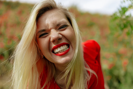 A close up of a woman with pink hair looking at the cameraの写真素材