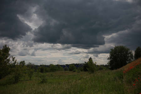 cloudy blue rainy sky over the field