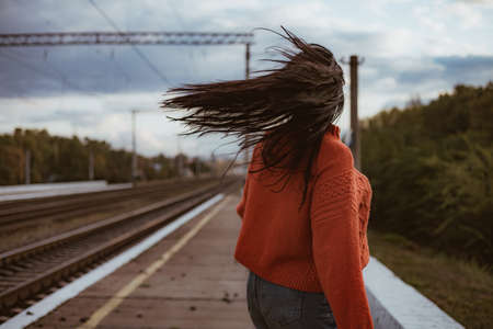 A person standing on a train track. High quality photo