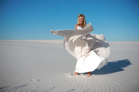 beautiful bride in maldives in wedding dress on the sandsの写真素材