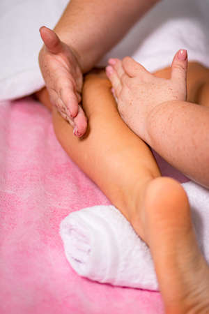 facial and body foot massage procedure in the spa salonの写真素材