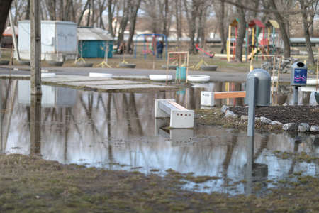 a huge puddle of water right on the playground
