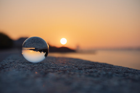 glass optical ball at sunset in the city in Ukraineの写真素材