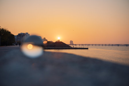 glass optical ball at sunset in the city in Ukraineの写真素材